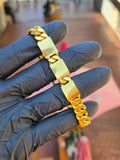 The 10.5MM Tri-ID bracelet across three fingers, its three blank plates spaced evenly along the Cuban link