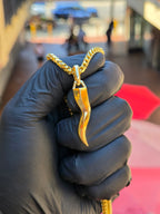Solid gold Italian Cornicello pendant, mirror-polished horn with a faceted twist, traditional S-curve and squared collar with hidden 7mm bail