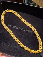 14.5MM Diamond-Cut Infinity Link Chain in solid gold, doubled figure-eight loops threaded through one another to form a continuous braid