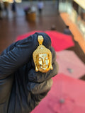 Solid gold Siddhartha Gautama Buddha Head Pendant, the hair cut as rows of frosted snail-shell curls rising into the ushnisha against a mirror-polished face, on an engraved scroll bail.