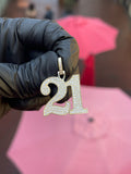 Yellow gold "21" Diamond Pendant, both numerals pave-set in round diamonds with a polished gold rim traced around the full outline and a pave bail.
