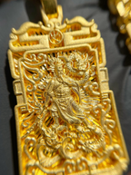 God of War and Dragon Fretwork gold pendant shown on a chain, cloud-scalloped crest and stepped frame visible