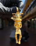 Solid gold 3D Standing Kachina Doll Pendant, front view of the sculpted figure with case mask, ruff and kilt