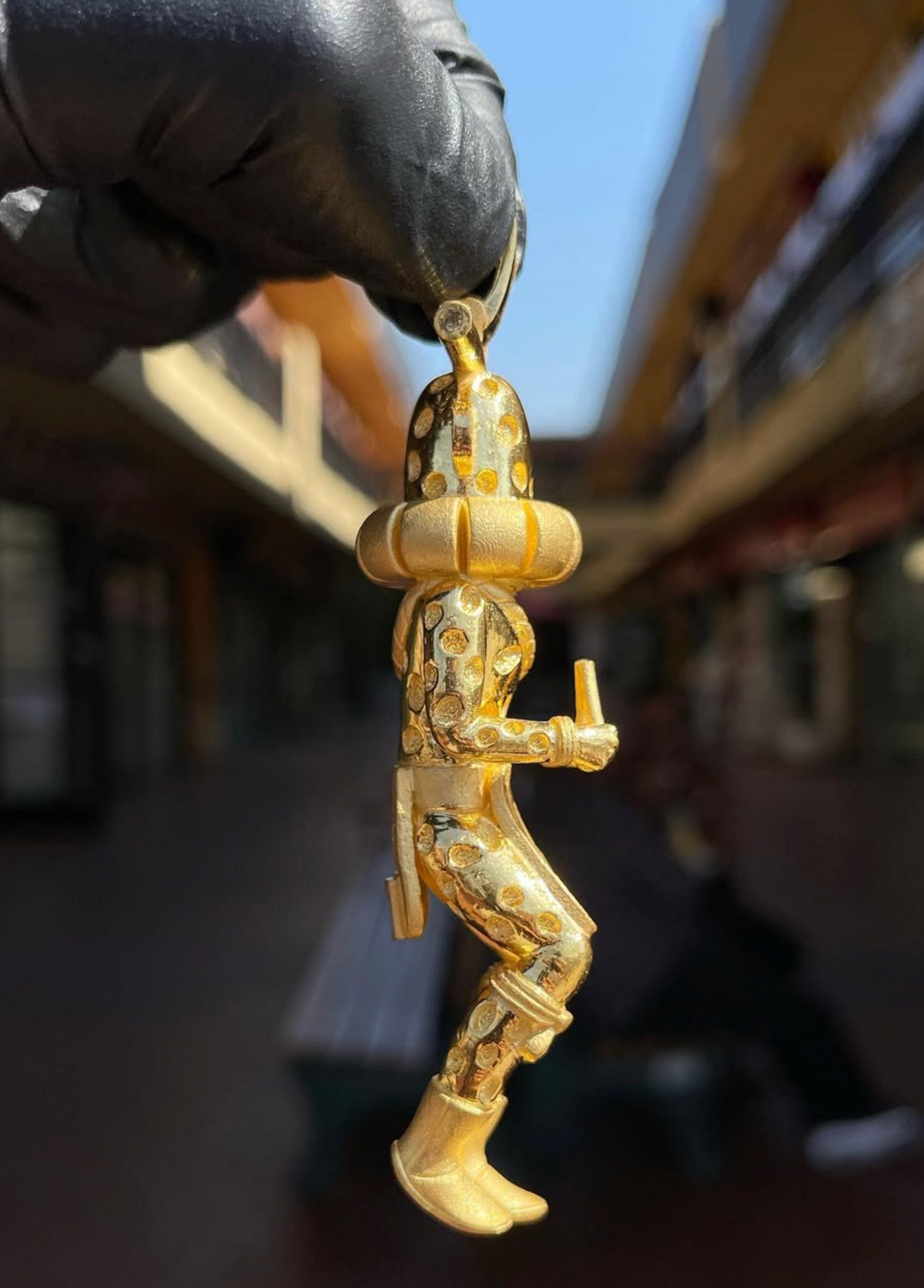 3D Standing Kachina Doll gold pendant, profile view showing the figure sculpted fully in the round
