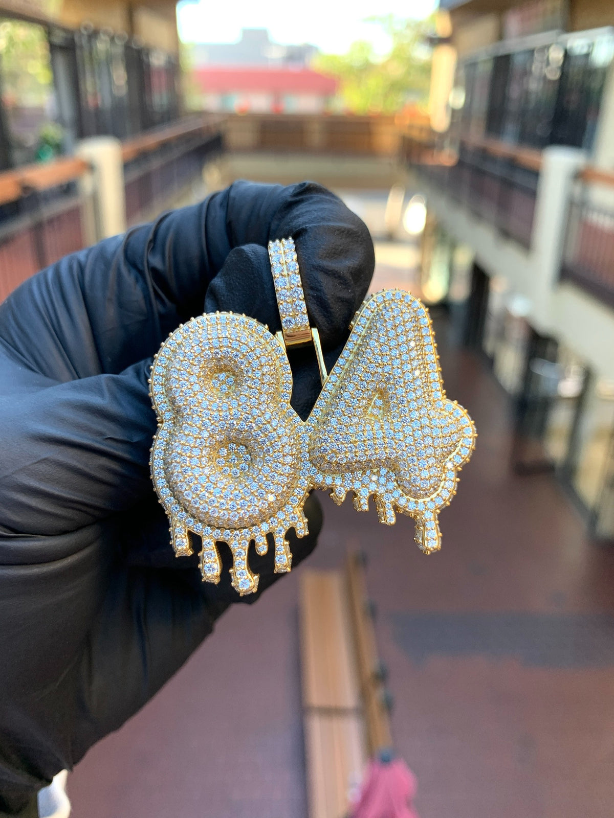 Yellow gold "84" Diamond Pendant, two bubble numerals fully pave-set in round diamonds with dripping points hanging from the lower edge of each.