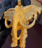 Decorated war elephant gold pendant, second view showing the veined ears and ringed trunk