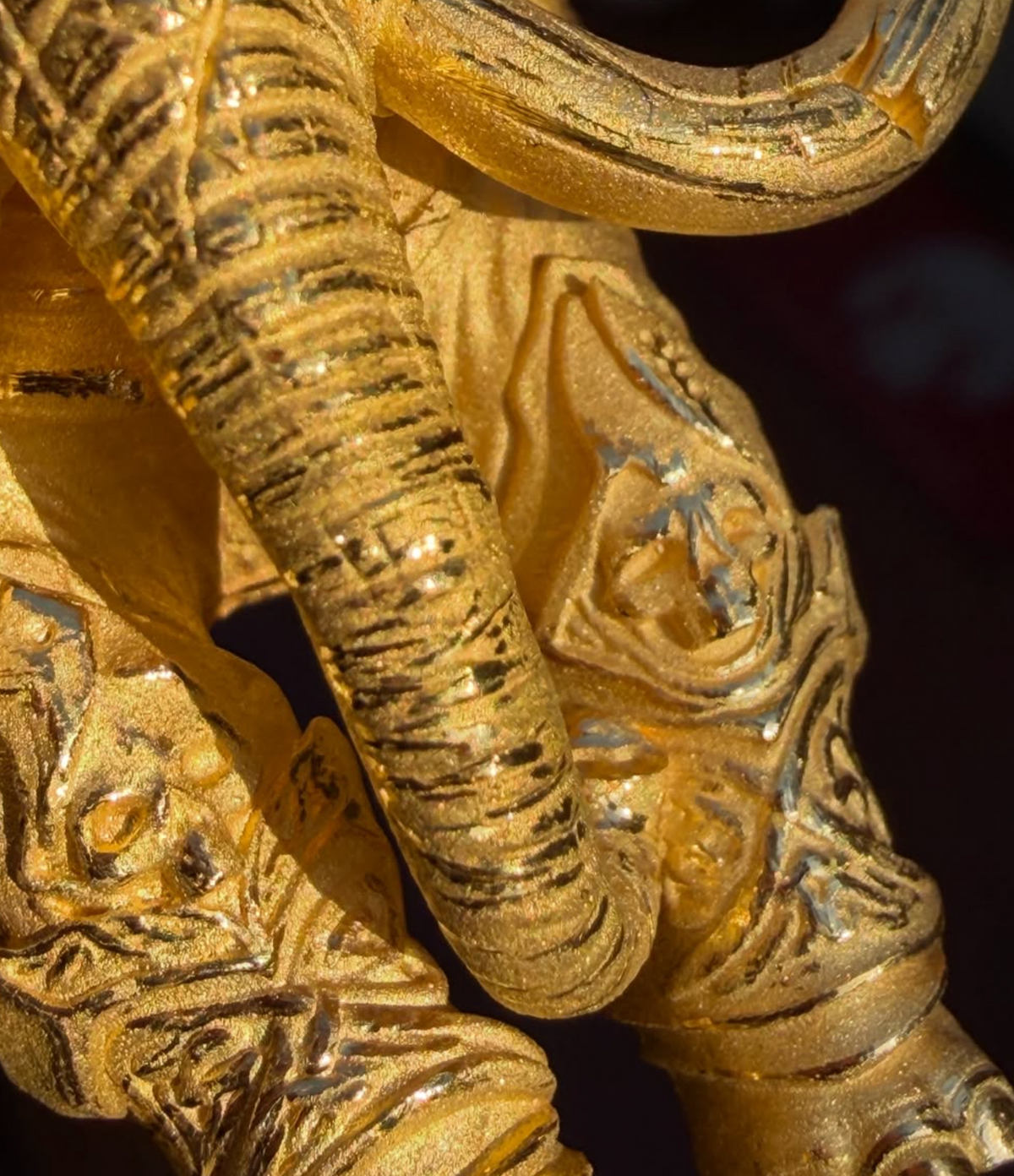 War elephant gold pendant detail, armoured leg panels with scrolling floral motifs