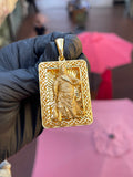Solid gold Guan Gong openwork rectangular pendant with pierced scroll border and open diamond-cut sunburst