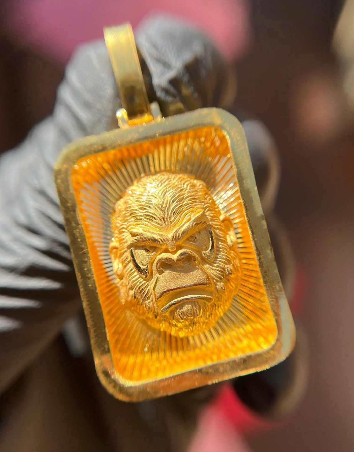 Solid gold Diamond-Cut Gorilla Face Rectangular Pendant, front view showing the carved gorilla face