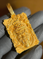 Guan Gong Face gold pendant showing the dragons carved up both side margins