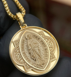 Gold Miraculous Medal pendant, the Virgin Mary in satin relief inside a polished Gothic star frame