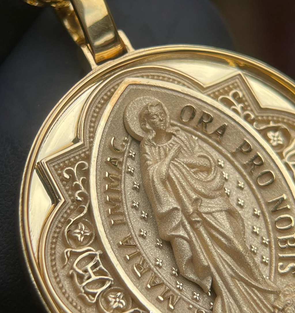 Immaculate Conception medal gold pendant detail, raised ORA PRO NOBIS lettering and star-flower ring