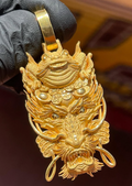Gold money frog and dragon pendant, the three-legged toad above a dragon's head with coins and ingots between