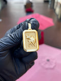 Solid gold Ox rectangular pendant, the zodiac ox in high relief on a satin field inside a polished frame