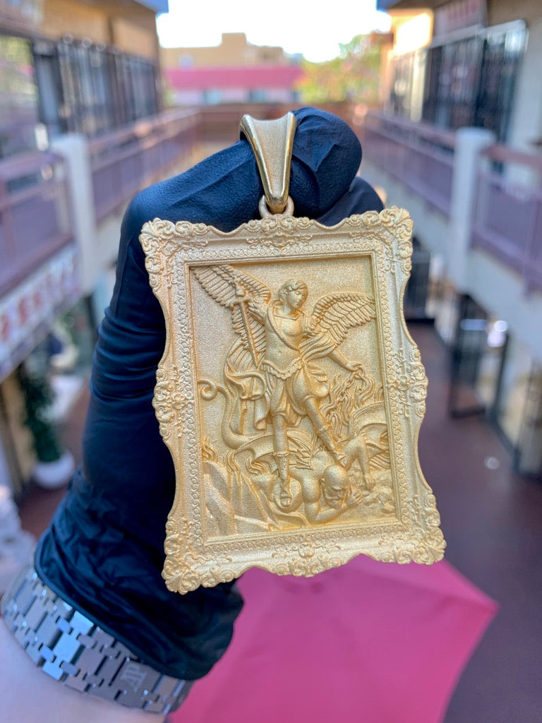 Solid gold Saint Michael pendant, the Archangel over the devil in relief inside an ornate Baroque picture frame