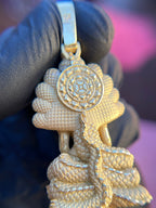 Thai Buddha gold pendant reverse detail, diamond-cut scale edges around the lotus wheel medallion