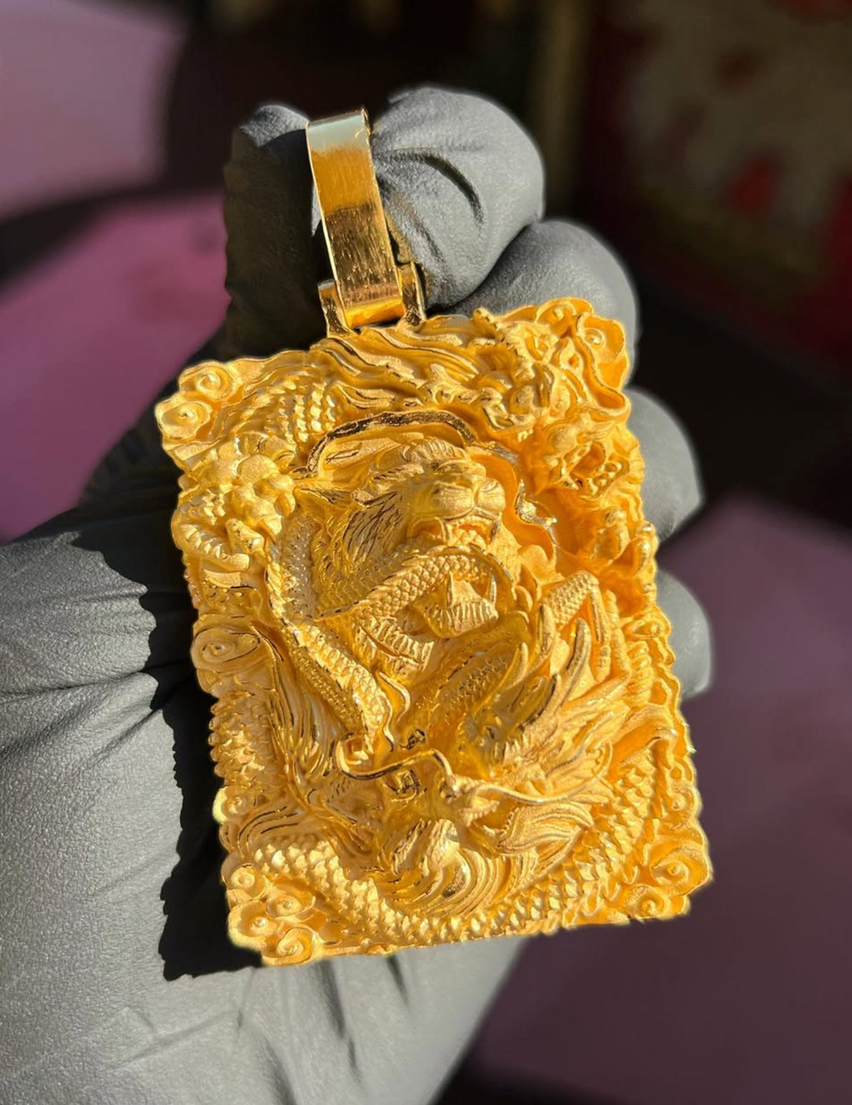 Solid gold Tiger and Dragon Power Pendant, front view with tiger and dragon carved in deep relief