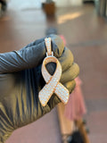 Rose gold Cancer Ribbon Diamond Pendant, the full ribbon face pave-set in round diamonds with a white gold collar and a pave-set bail.