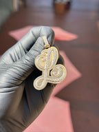 Cursive letter L diamond pendant in yellow gold, script outlined in double-row pave diamonds