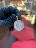 Solid gold Dharma Wheel Circular Pendant, an eight-spoked dharmachakra with each spoke cut as a pillar around a beaded lotus hub, on a plain polished bail.