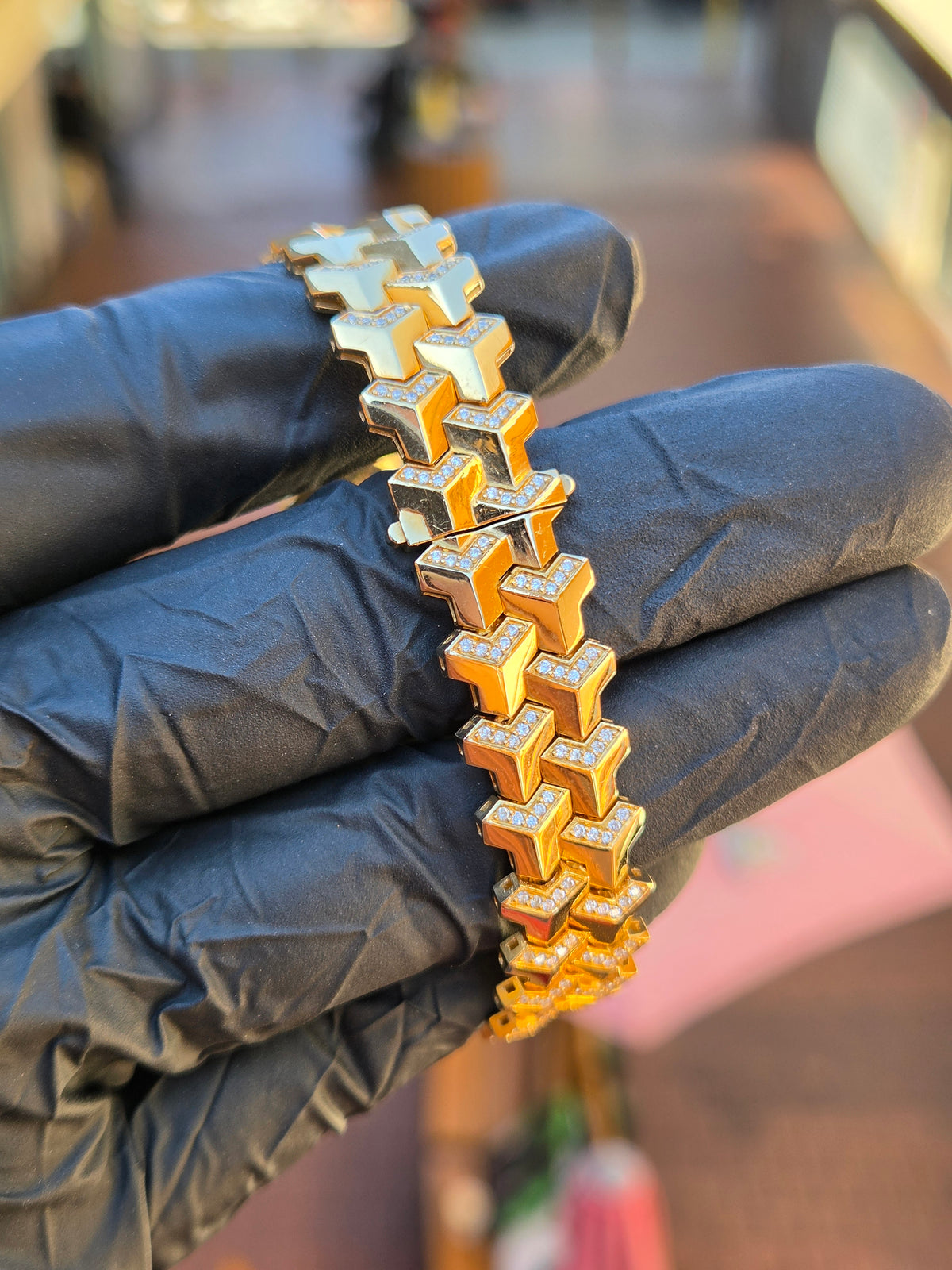 Diamond Armor bracelet held upright, showing how the chevron links interlock through the clasp