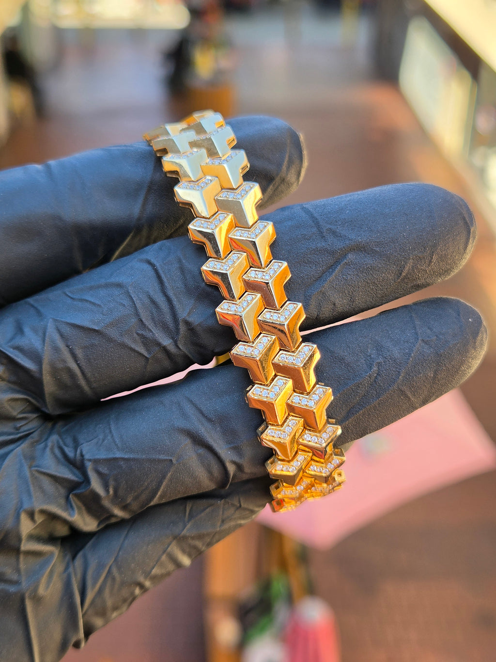 Full length of the Diamond Armor bracelet across the fingers, alternating polished and diamond-set faces