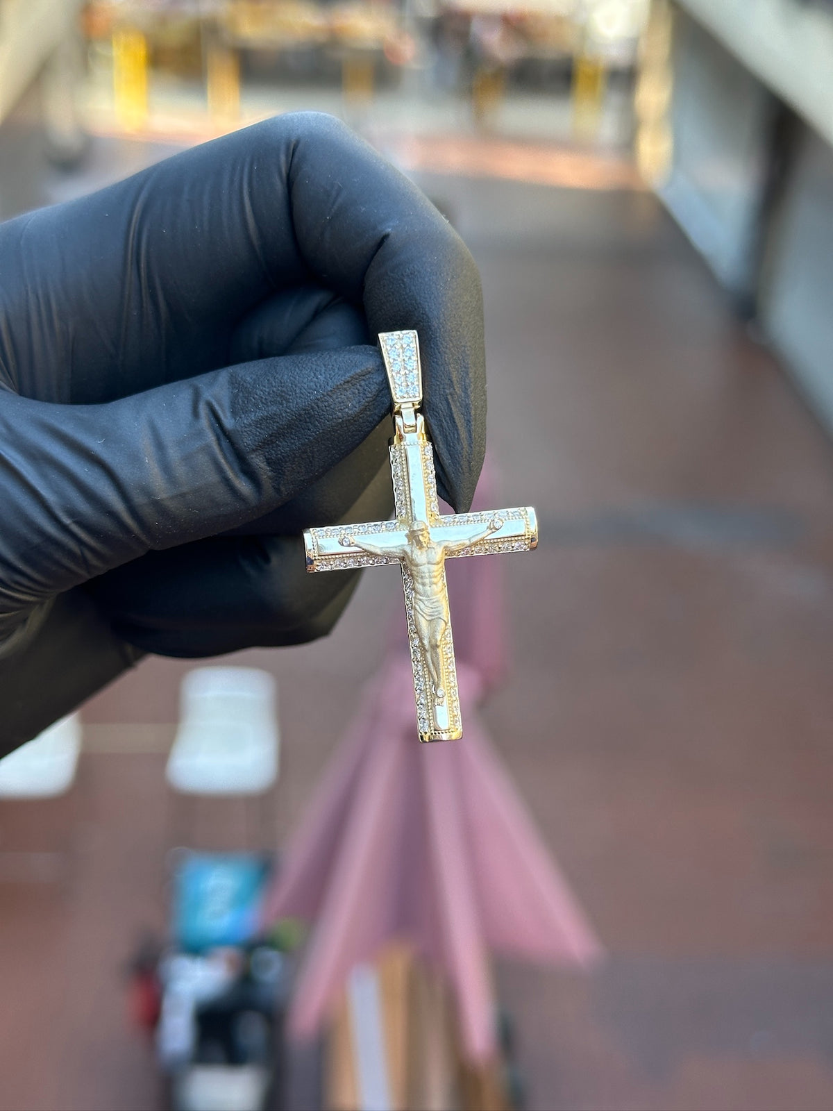 Detailed Crucifix diamond pendant, pave bail and tapered cross arms in solid gold