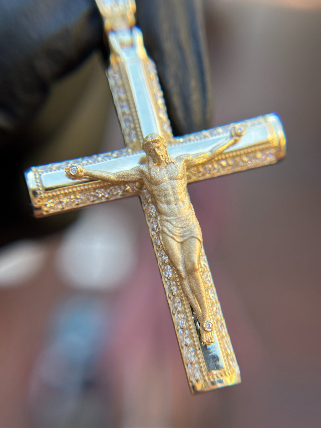 Diamond Detailed Crucifix pendant, carved corpus and diamond-set channels in yellow gold