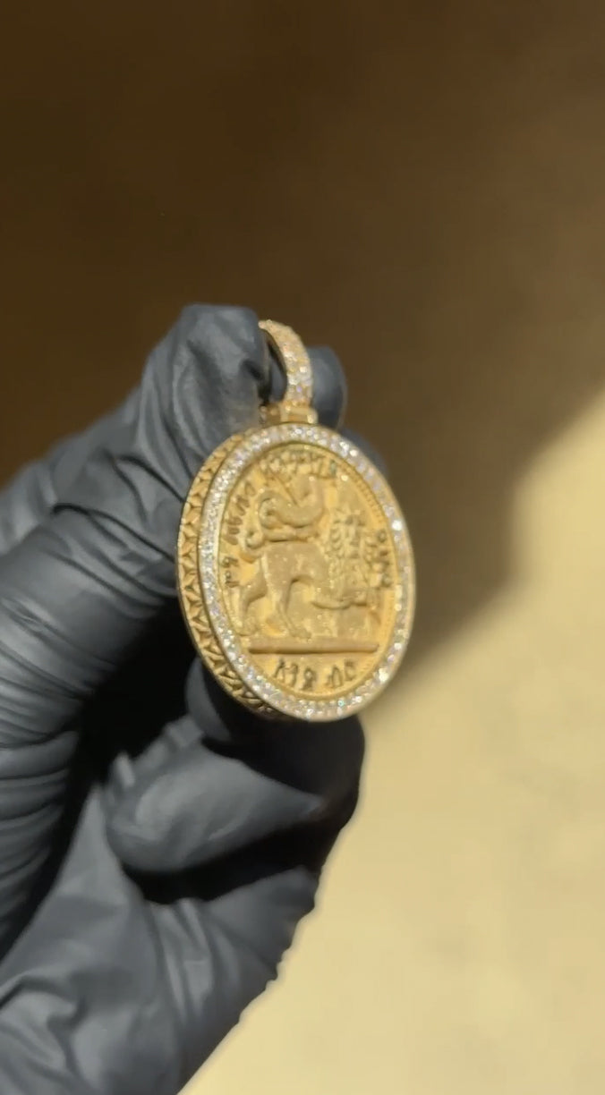 Double-sided Musa of Mali diamond pendant, Ethiopian Lion of Judah face with Amharic inscription inside a pave rim