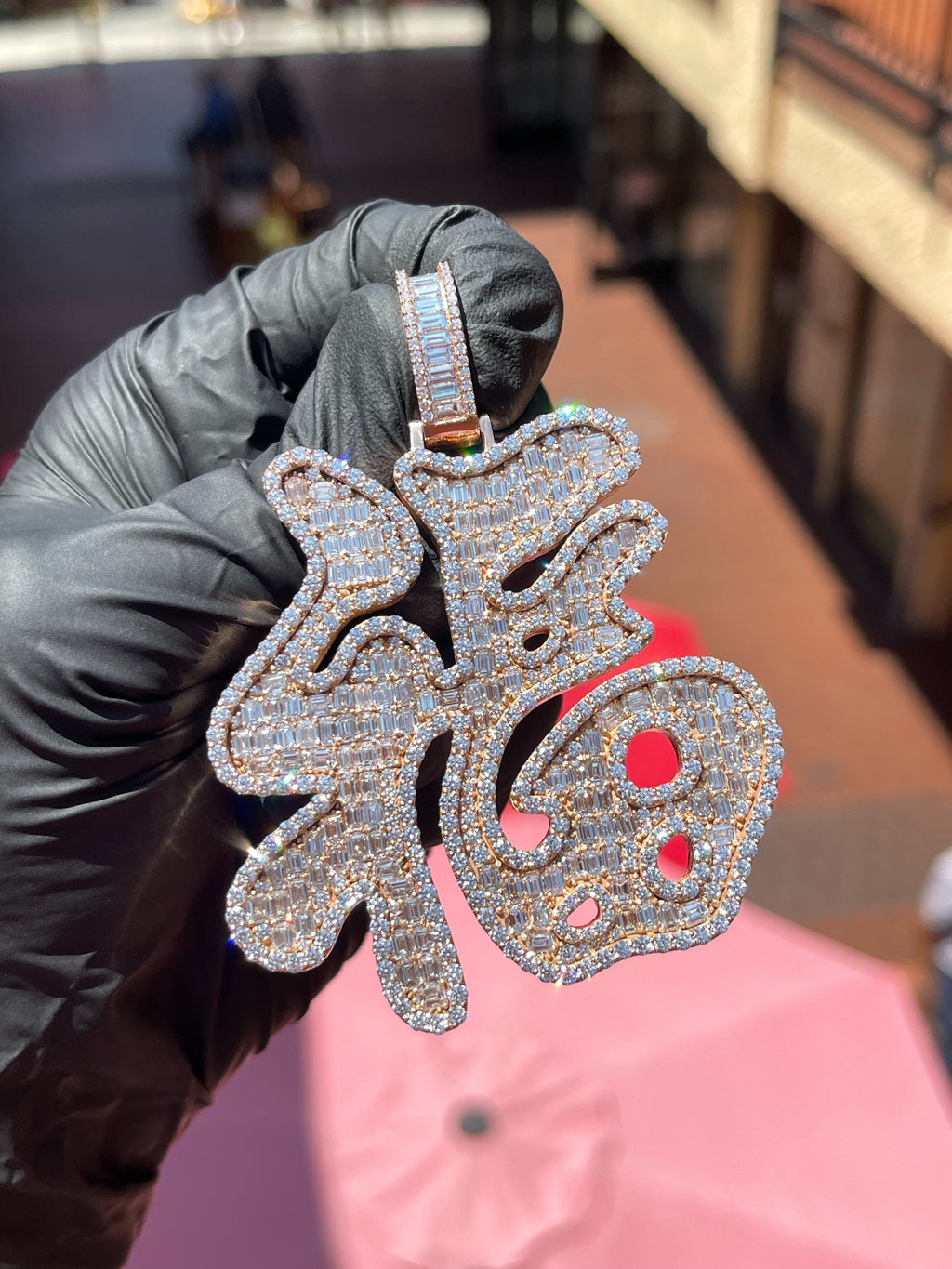 White gold Fu (Lucky) Diamond Pendant, the Chinese character fu built from channel-set emerald-cut diamonds and outlined throughout in round diamonds.