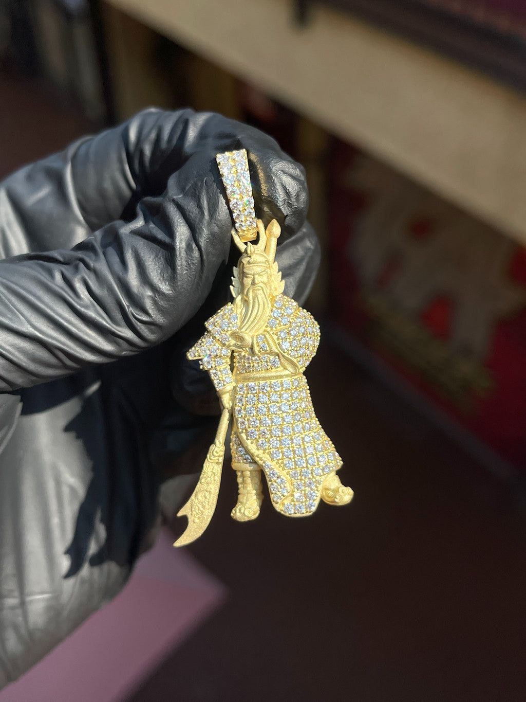 Yellow gold God of War (Guan Gong) Partial Diamond Pendant, the robe and armour pave-set in diamonds with the bearded face, crown and glaive left in bare satin gold.