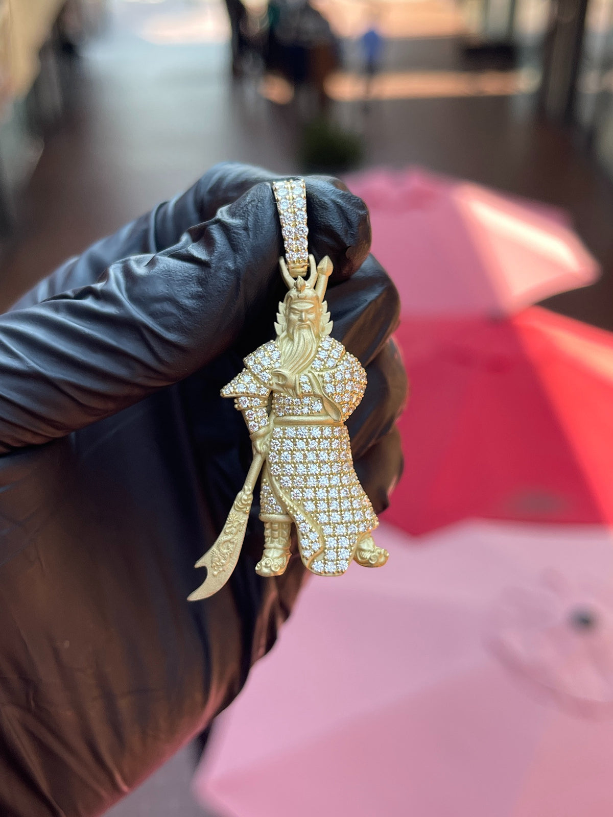 Angled view of the God of War (Guan Gong) Partial Diamond Pendant showing the depth of the standing figure and the carved blade held at his side.