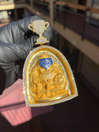 Yellow gold Happy Buddha with a Bandana Arch Frame Diamond Pendant, a seated laughing Buddha wearing a blue enamel paisley bandana inside a diamond-edged arch, topped by a hinged pave-set trophy cup.