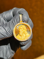 Christ portrait medallion in warm light, hair and beard carved into separated strands falling to the shoulder