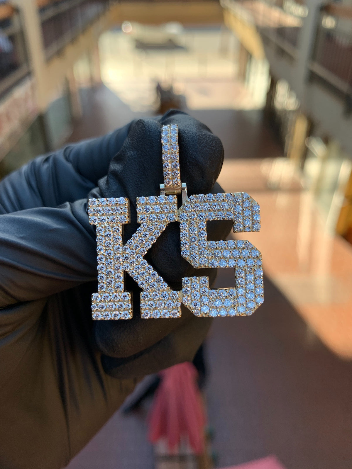 White gold "KS" Diamond Pendant, two block capitals fully pave-set in round diamonds with a raised polished rim around each letter and a pave bail.