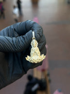 Full view of the Lady Buddha (Guan Yin) Partial Diamond Pendant showing the open lotus base with polished petal tips and the multi-row pave bail.