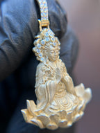 Three-quarter view of the Lady Buddha (Guan Yin) Partial Diamond Pendant showing the sculpted robe folds and full-petal lotus relief.