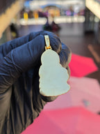 Plain mirror-polished back of the Guan Yin Riding a Dragon pendant, following the same lotus-bud outline, with the bail stamp