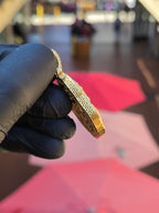 Edge view of the Medium Happy Buddha pendant showing the coin pattern pierced right through the side wall