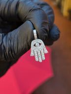 Mini Hamsa pendant showing the four fingers separated by slots cut right through, each its own run of stones