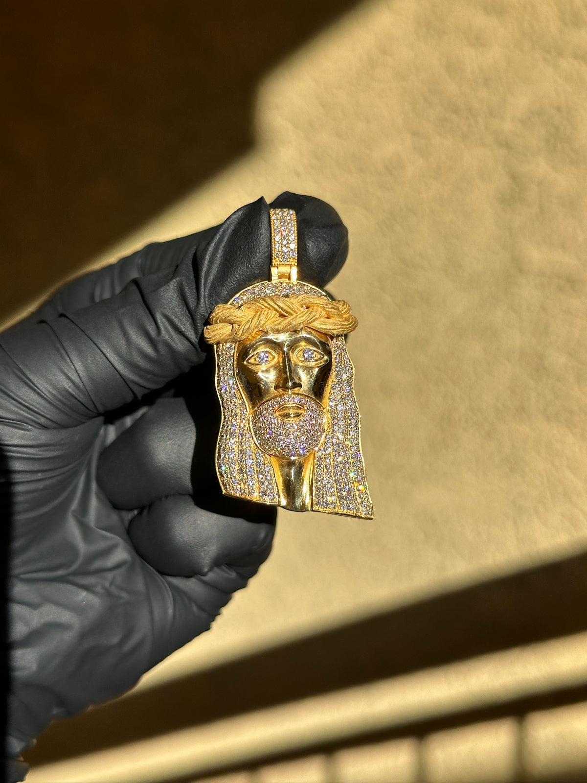 Partially Iced diamond Jesus pendant in yellow gold, polished face with pave hair, beard and satin crown of thorns