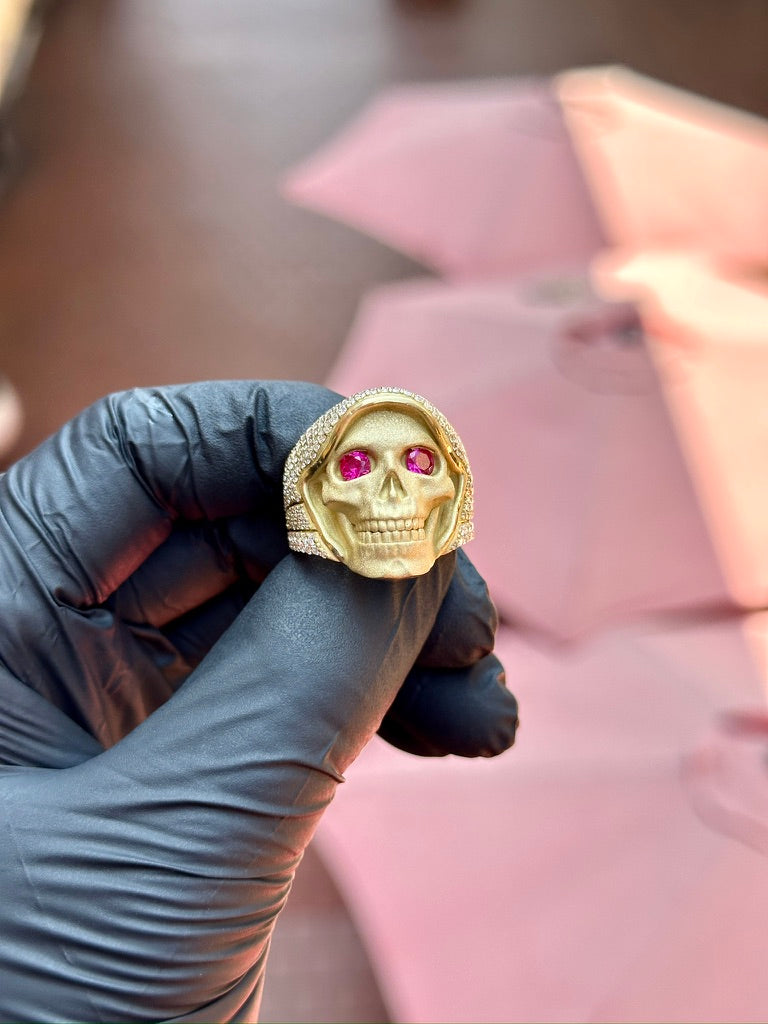 Red Eyed Santa Muerte Ring, sculpted skull face with a diamond-set hood and red ruby eyes