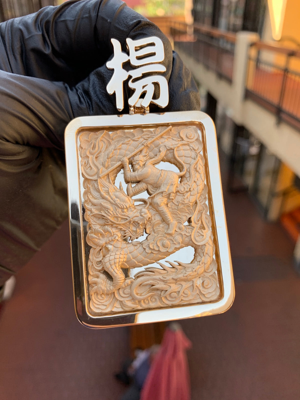 Intricately carved custom dragon pendant